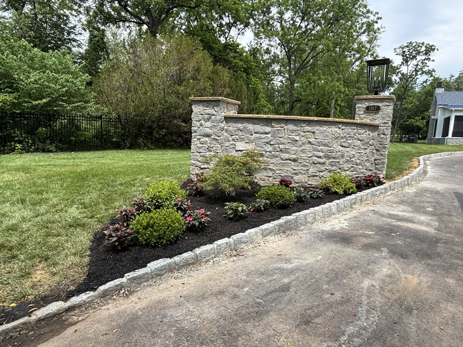 Custom Cobblestone Driveway Edging & Landscape Design project photo 2